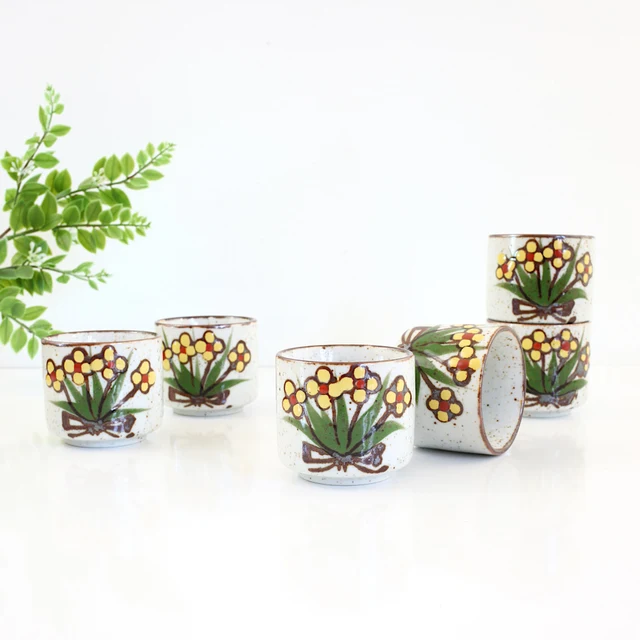 Speckled yellow-flower handleless tea cups