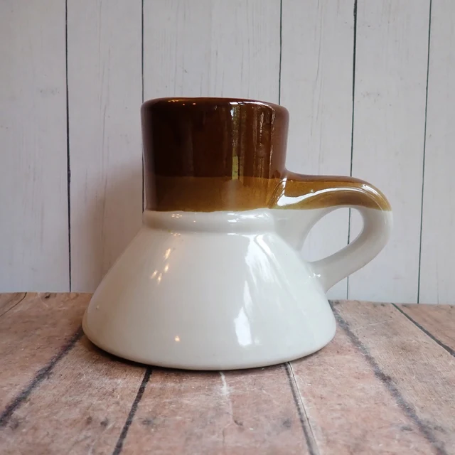 Unmarked brown-and-cream broad-base travel mug